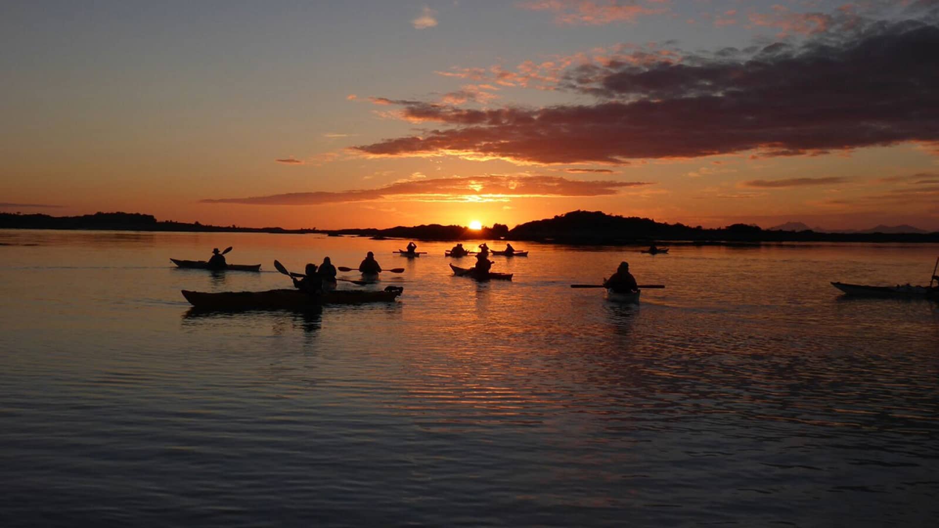 Sea kayaking under the midnight sun in the Lofoten Islands.